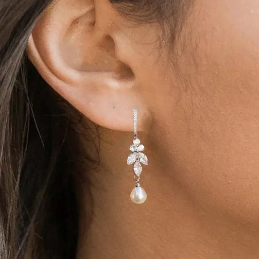 Earrings with dangling pearls in zirconia leaves Unique Joyas
