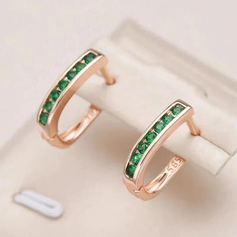 Elegant earrings with green crystals set in gold Unique Joyas