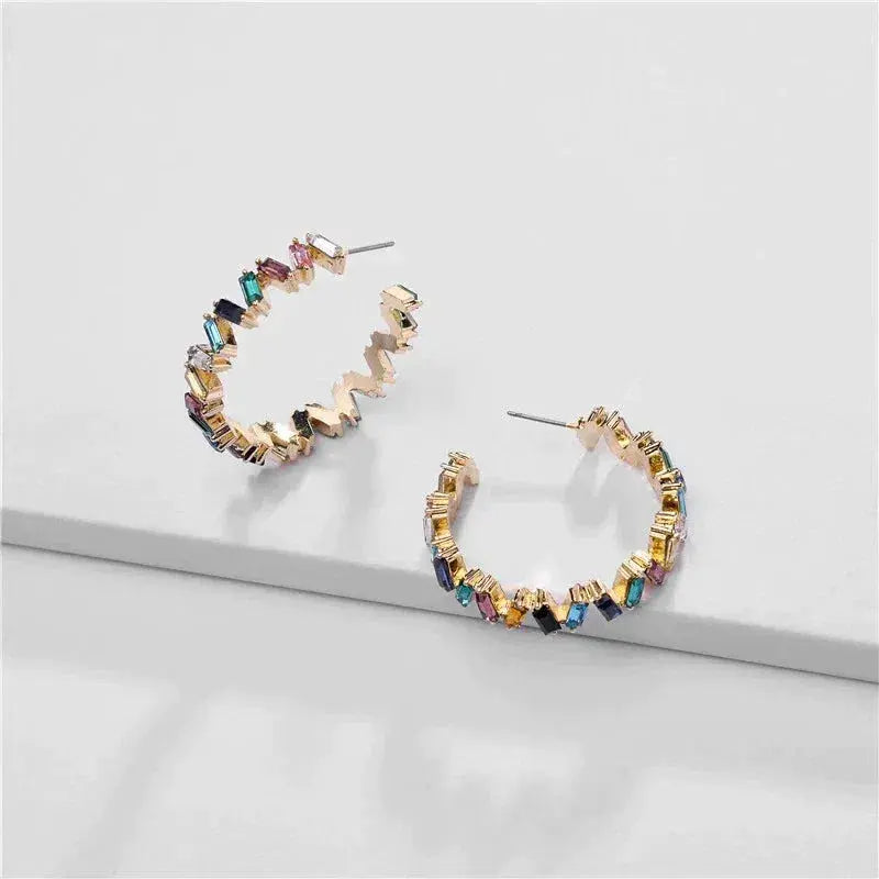 Gold earrings with colored stones Unique Joyas