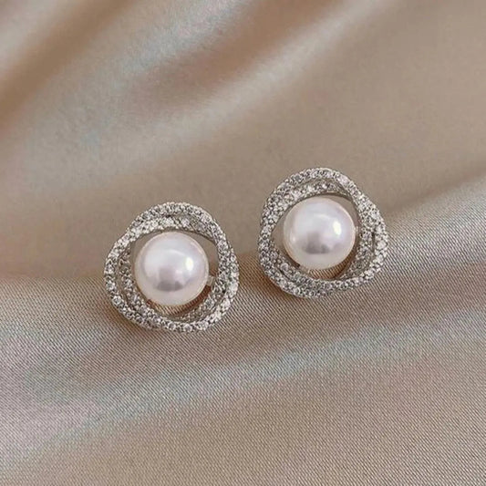 Shiny spiral earrings with elegant pearls Unique Joyas